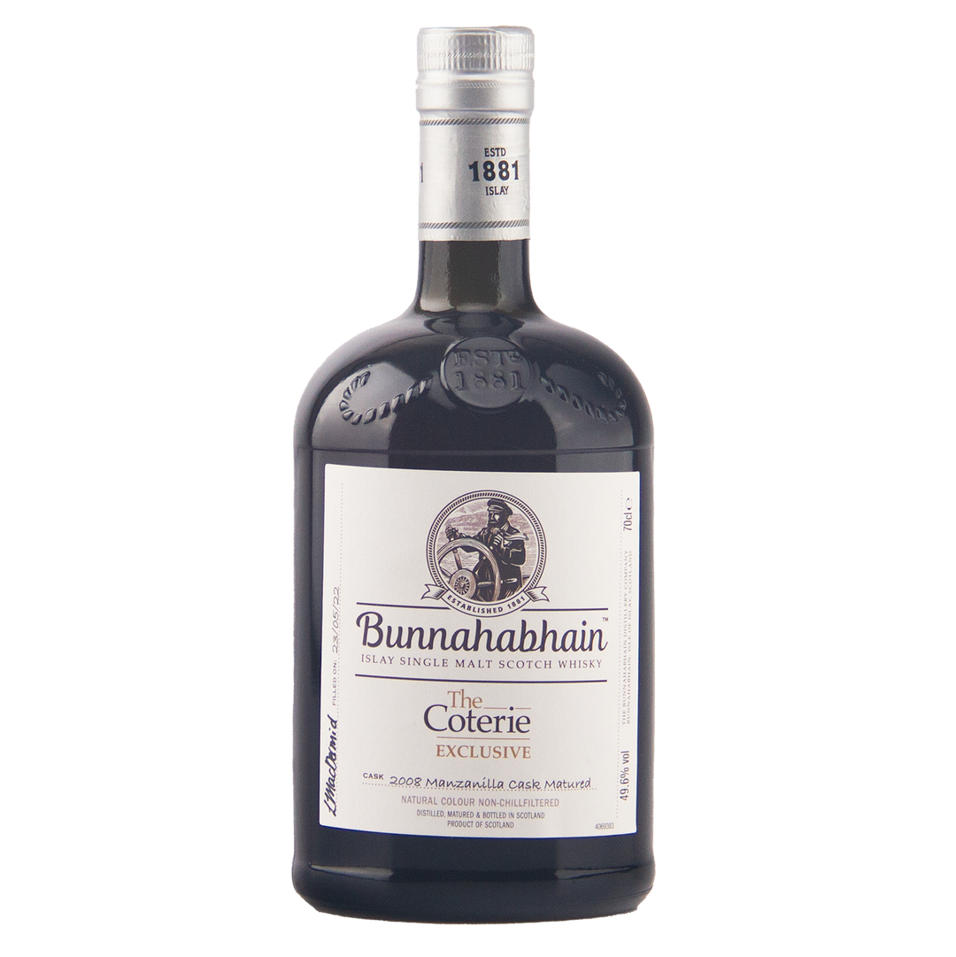 A bottle of Bunnahabhain The Coterie Exclusive single malt scotch whisky on a plain white background.