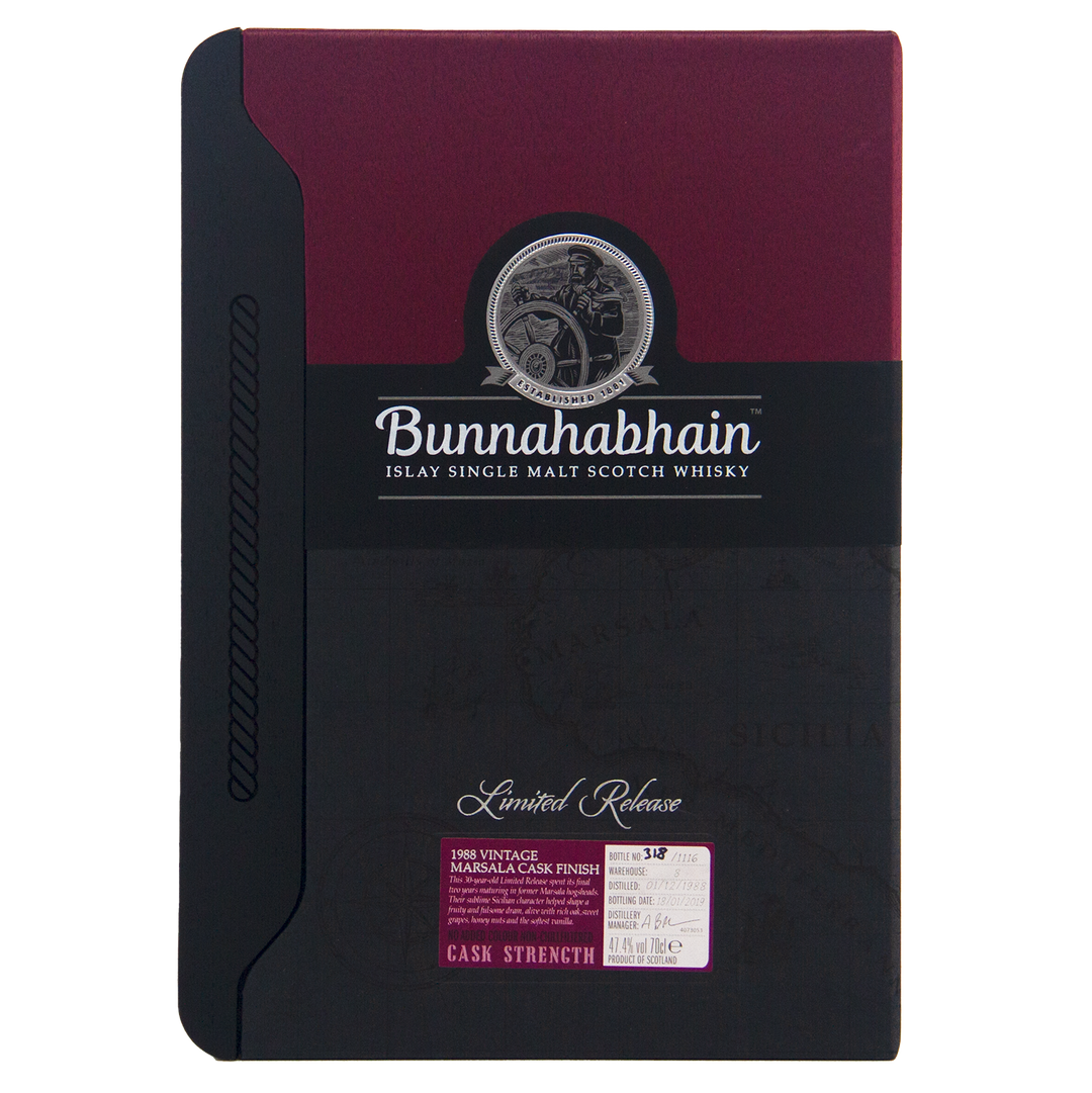 A box of Bunnahabhain 30 Year Old 1988 Vintage single malt whisky, Limited Release, with a maroon and black design, round logo, Marsala cask finish label, and cask strength information.