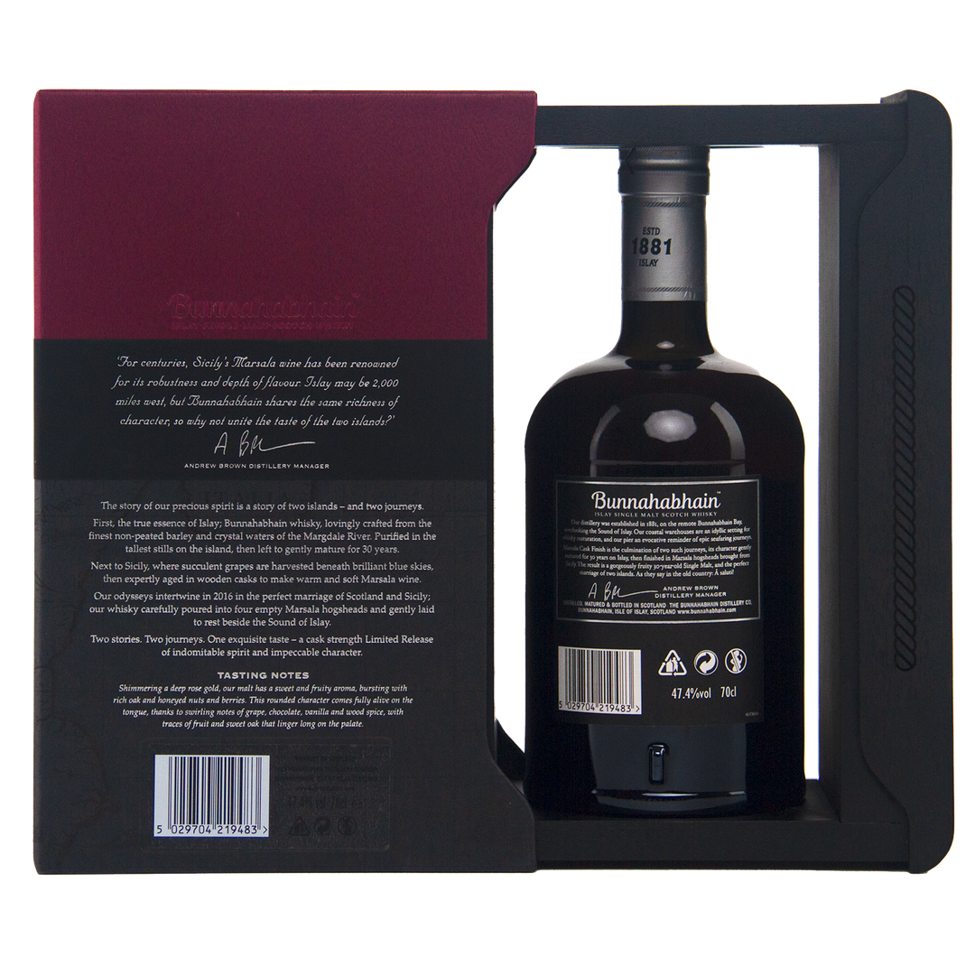 A bottle of Bunnahabhain 30 Year Old 1988 Vintage is showcased in a partially open black and burgundy box, with the bottle visible through a cutout and detailed text displayed on the side of the box.