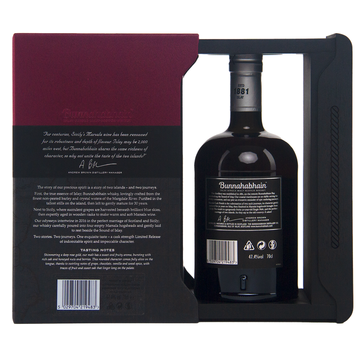 A bottle of Bunnahabhain 30 Year Old 1988 Vintage is showcased in a partially open black and burgundy box, with the bottle visible through a cutout and detailed text displayed on the side of the box.