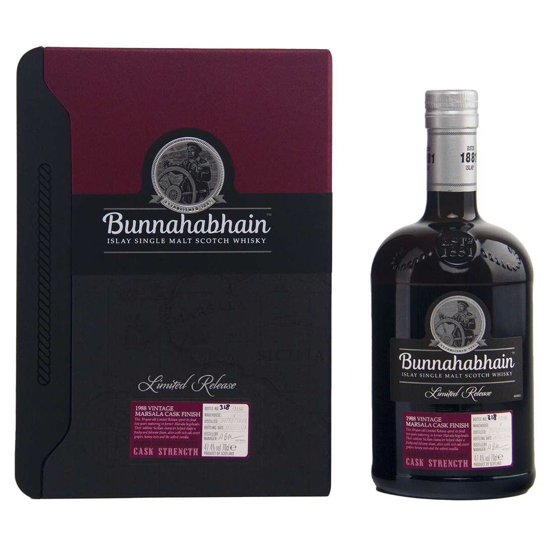 A bottle and box of Bunnahabhain 30 Year Old 1988 Vintage single malt whisky, with a maroon and black design, silver accents, and the distillery logo on both the bottle and the box.