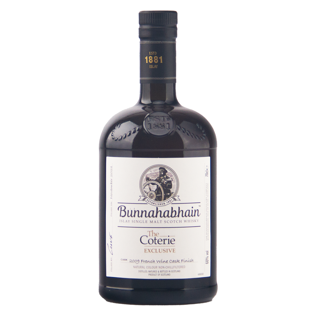 A bottle of Bunnahabhain The Coterie Exclusive single malt Scotch whisky on a plain white background.