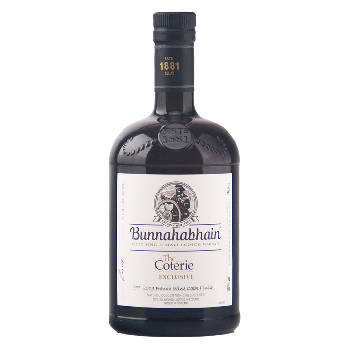 A bottle of Bunnahabhain The Coterie Exclusive single malt Scotch whisky on a plain white background.