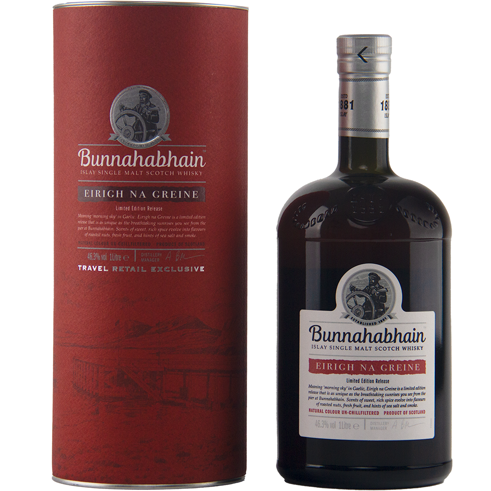 A bottle of Bunnahabhain Eirigh Na Greine single malt Scotch whisky, matured in red wine casks, stands next to its matching red cylindrical box, both featuring the brand’s logo and product info in white and black text.