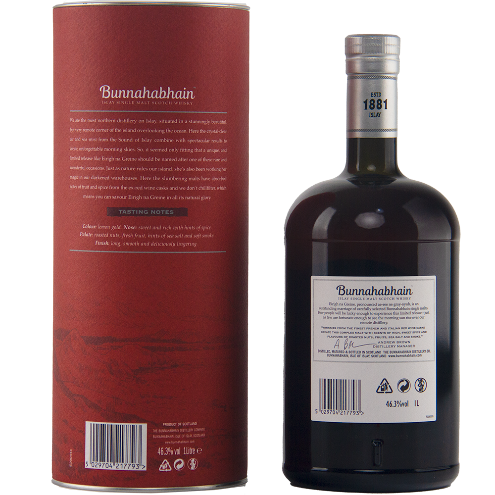 A dark bottle of Bunnahabhain Eirigh Na Greine single malt Scotch whisky with a black cap stands beside its cylinder. Both feature tasting notes, the year 1881, and details on its red wine cask maturation on their detailed labels.