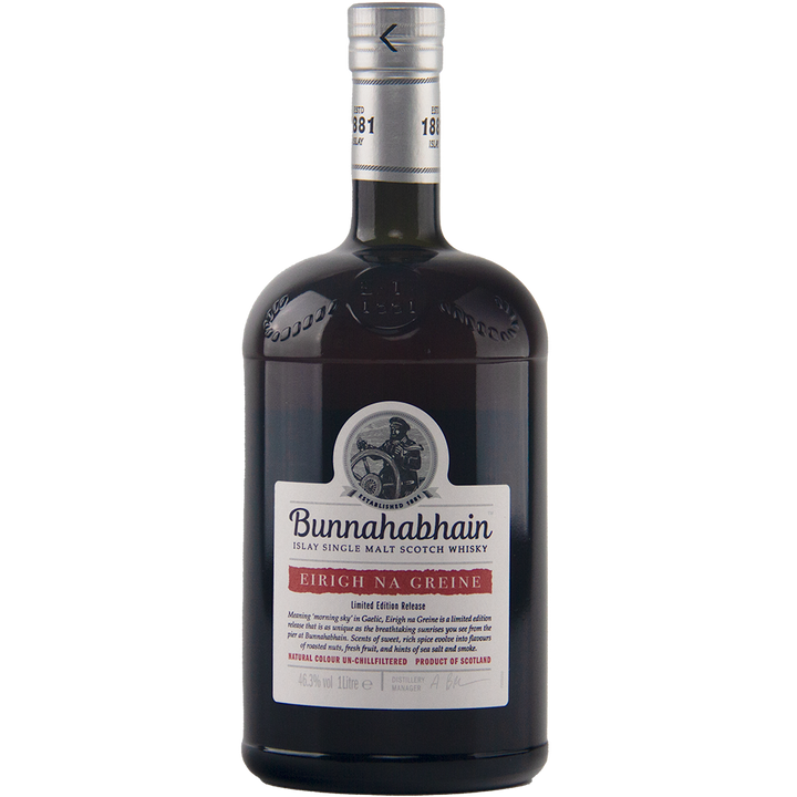 A dark glass bottle of Bunnahabhain Eirigh Na Greine single malt Scotch whisky, matured in red wine casks, with a cream cap and a label displaying a sailor illustration and red "Eirigh Na Greine Limited Edition Release" text.