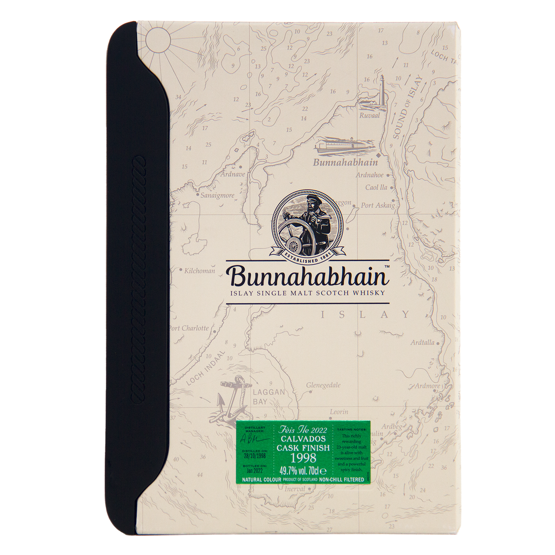 A box of Bunnahabhain Fèis Ìle 2022 1998 Calvados Cask Finish single malt Scotch whisky, featuring a map design background, black spine, and green label, reminiscent of the distillery’s special release packaging.