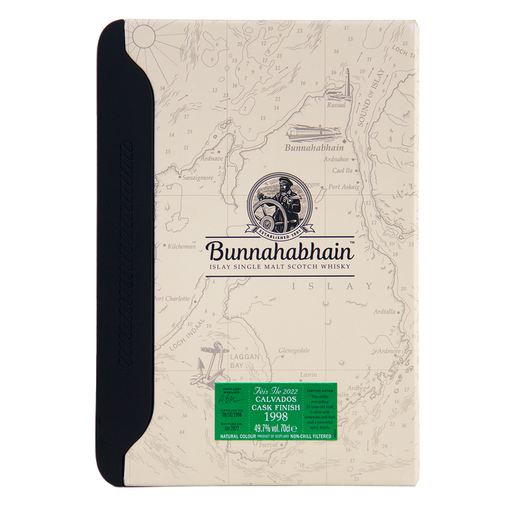 A box of Bunnahabhain Fèis Ìle 2022 1998 Calvados Cask Finish single malt Scotch whisky, featuring a map design background, black spine, and green label, reminiscent of the distillery’s special release packaging.