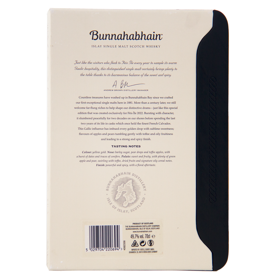 The back of a Bunnahabhain Fèis Ìle 2022 1998 Calvados Cask Finish box features descriptive text, tasting notes, a signature, the distillery logo, and a barcode on a mainly white box with a black side panel.