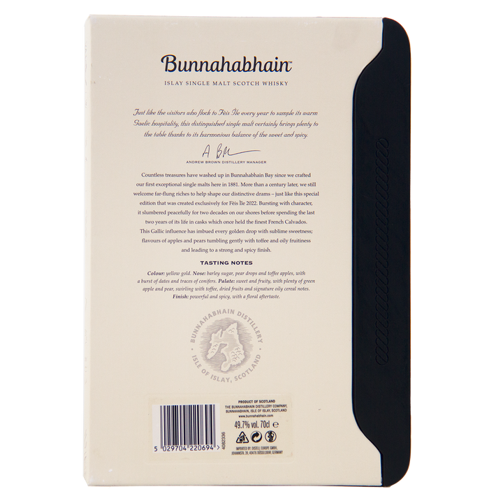 The back of a Bunnahabhain Fèis Ìle 2022 1998 Calvados Cask Finish box features descriptive text, tasting notes, a signature, the distillery logo, and a barcode on a mainly white box with a black side panel.