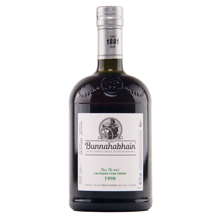 A dark glass 700ml bottle of Bunnahabhain Fèis Ìle 2022 1998 Calvados Cask Finish single malt Scotch whisky, 49% ABV, featuring a white label, black cap, and detailed branding.
