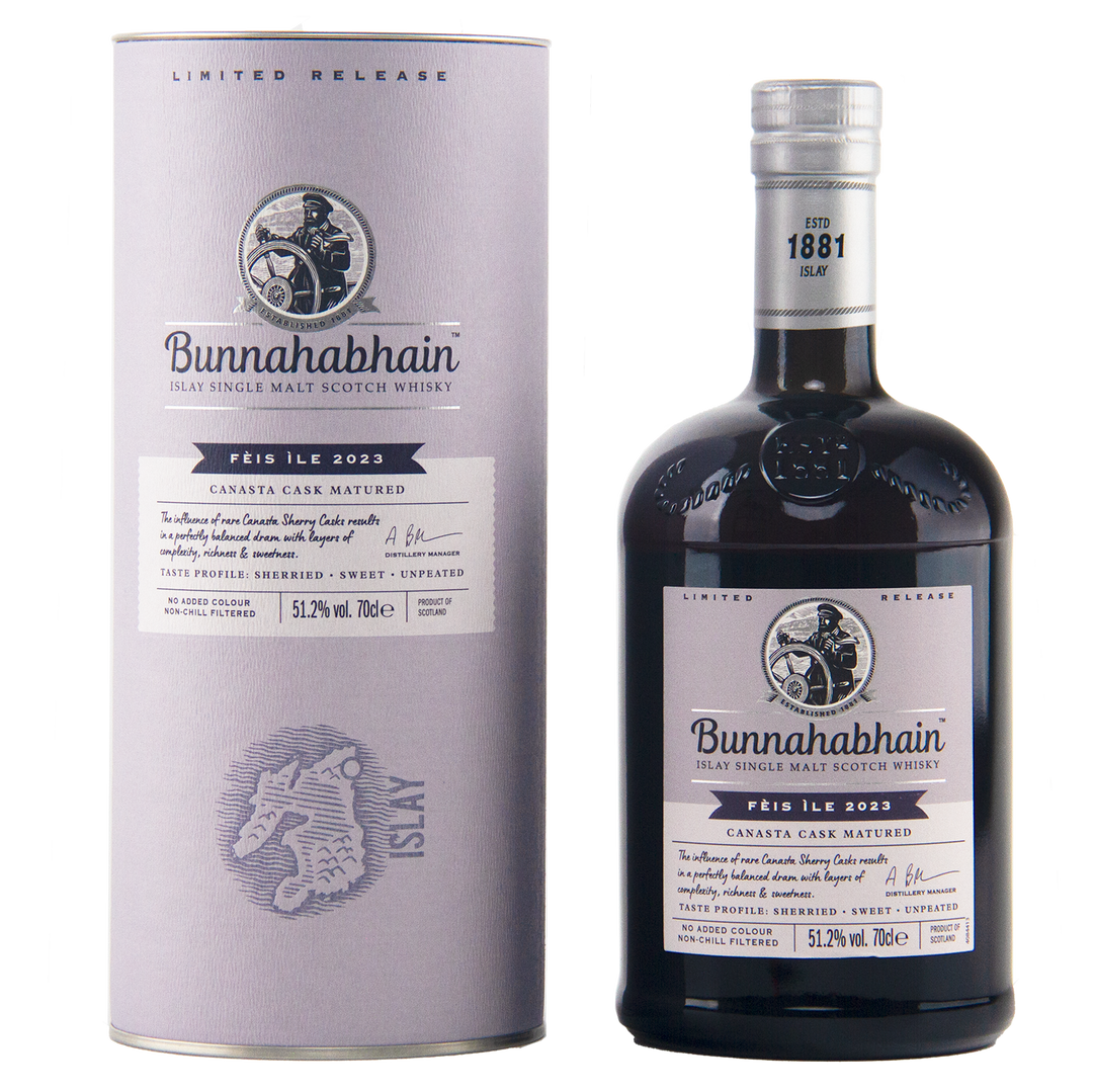 A bottle of Bunnahabhain Perth Ile 2023 single malt Scotch whisky next to its matching cylindrical packaging box, both in a clean studio setting.