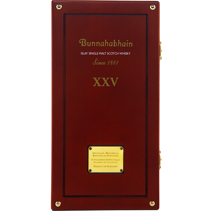 A wooden box for Bunnahabhain XXV 25 Year Old Single Malt Scotch Whisky, with gold lettering and a plaque, celebrates this limited edition malt distilled and bottled in Scotland since 1881.