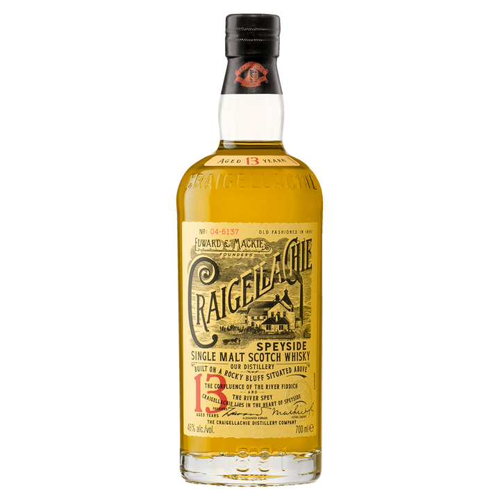 A bottle of Craigellachie 13 Year Old Single Malt Whisky, featuring a yellow label with black and red text and vintage-style illustrations.