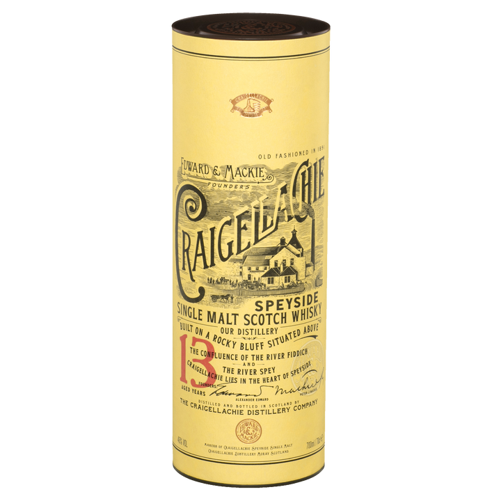 A cylindrical yellow container of Craigellachie 13 Year Old Single Malt Whisky, non-chill filtered, with vintage-style black and red text and a distillery illustration.