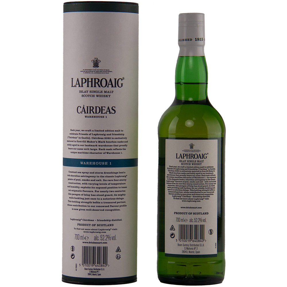 A bottle of Laphroaig Cairdeas 2022 Warehouse 1 Islay single malt stands beside its matching cylindrical box, both featuring black and green branding and descriptive text.
