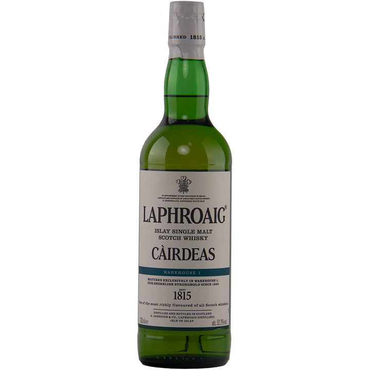 A green bottle of Laphroaig Cairdeas 2022 Warehouse 1 Scotch whisky with a white label and green cap features the brand name and limited-release details in black and blue text.