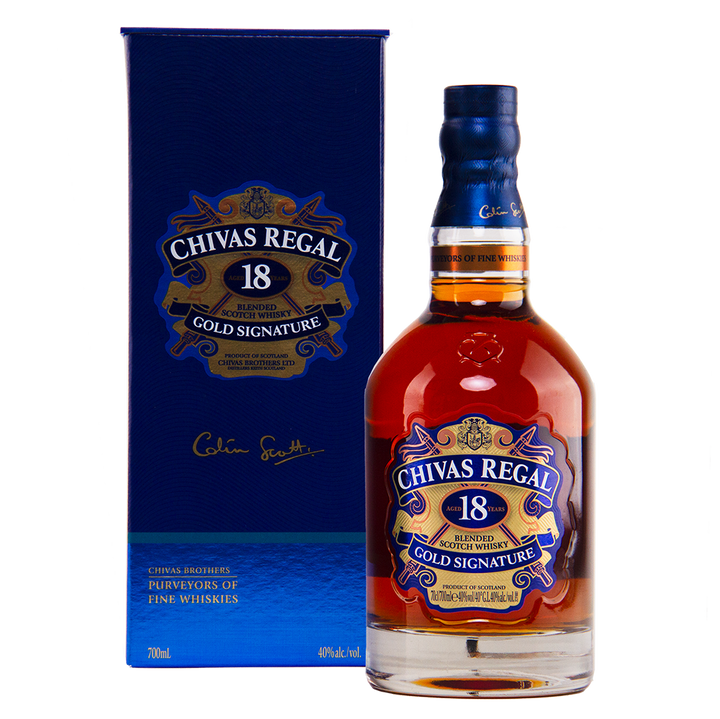 A bottle of Chivas Regal 18 Year Old Blended Scotch Whisky is showcased in front of its blue and gold box, both featuring the brand's logo and signature.