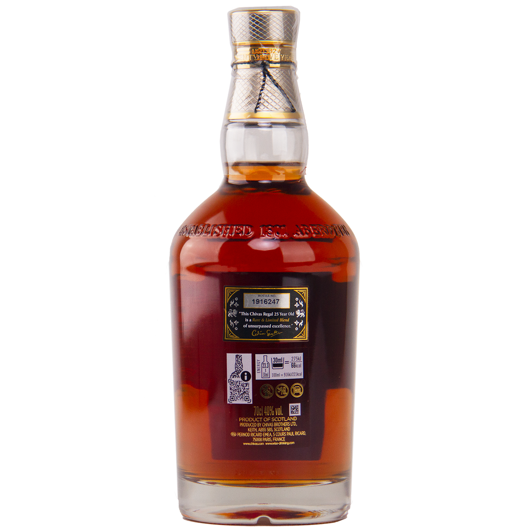 A clear glass bottle of Chivas Regal 25 Year Old Blended Scotch Whisky filled with dark brown liquor, sealed with a gold and silver cap. The back label shows a serial number, barcodes, product details, and embossed text near the neck.