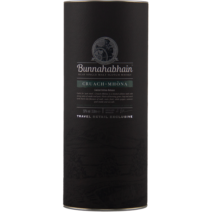 A black cylindrical container of Bunnahabhain Cruach Mhona Single Malt Scotch Whisky features silver text, a green label, a logo, and "Travel Retail Exclusive" marked at the bottom.