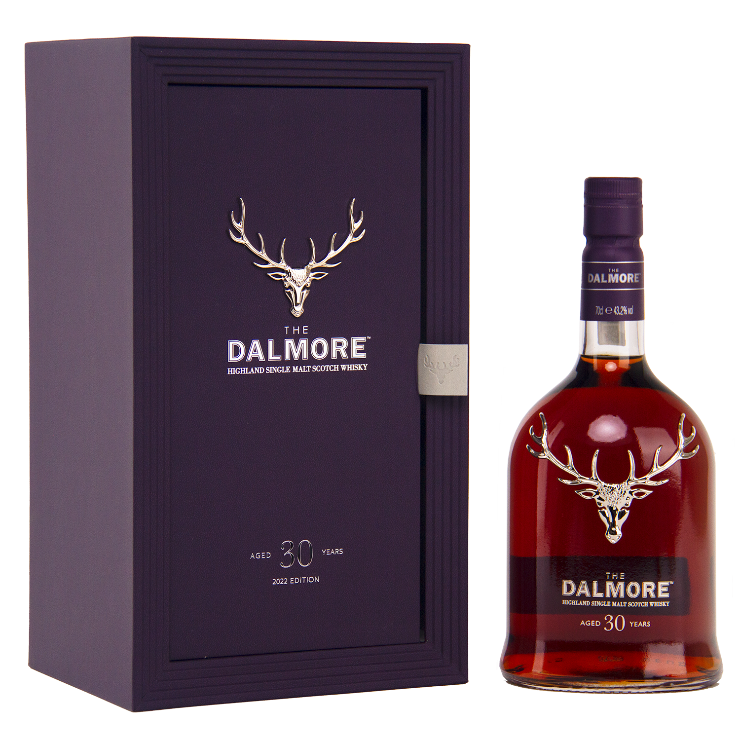 A bottle of The Dalmore 30 Year Old Single Malt Scotch Whisky stands next to its elegant dark purple box, both showcasing a silver stag logo and white text denoting the exclusive 2023 edition.