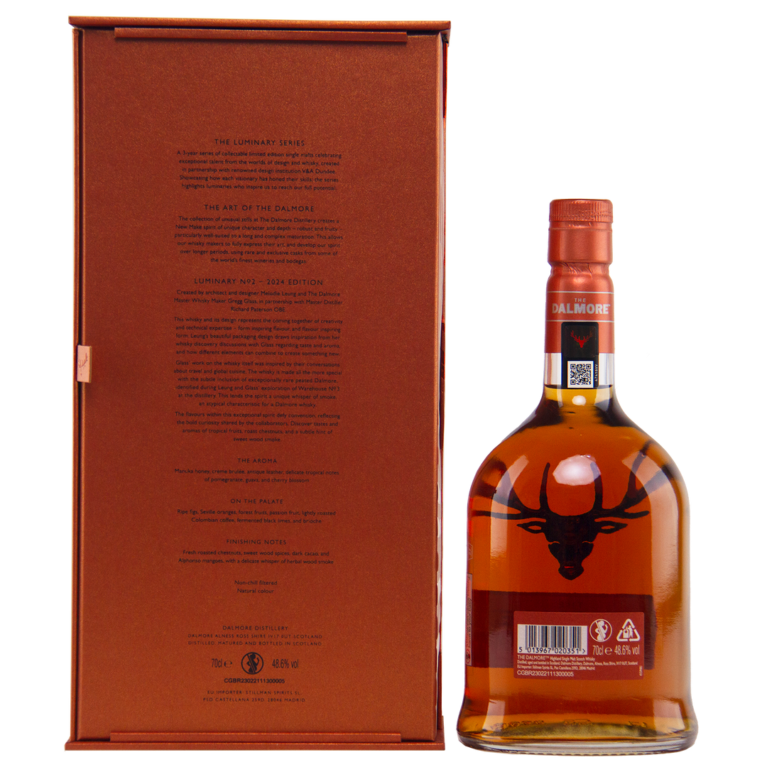 A bottle of The Dalmore Luminary No. 2 16 Year Old Single Malt Scotch Whisky with a copper cap stands by its branded box; the bottle shows the stag logo and barcode, while the box features detailed branding on the back.