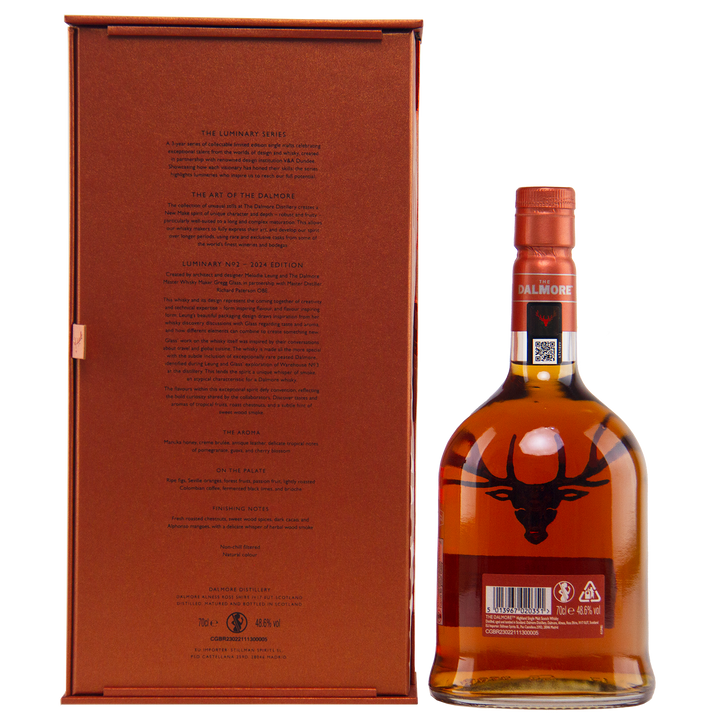 A bottle of The Dalmore Luminary No. 2 16 Year Old Single Malt Scotch Whisky with a copper cap stands by its branded box; the bottle shows the stag logo and barcode, while the box features detailed branding on the back.