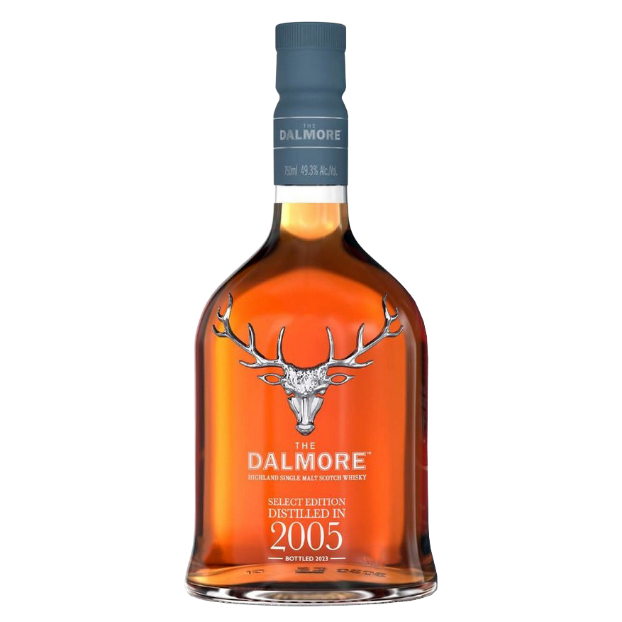 A bottle of The Dalmore 18 Year Old 2005 Vintage Single Malt Whisky features a stag logo, blue cap, rich amber liquid, and bears “Distilled in 2005” and “Bottled 2023,” crafted as a sherry cask Highland Scotch.