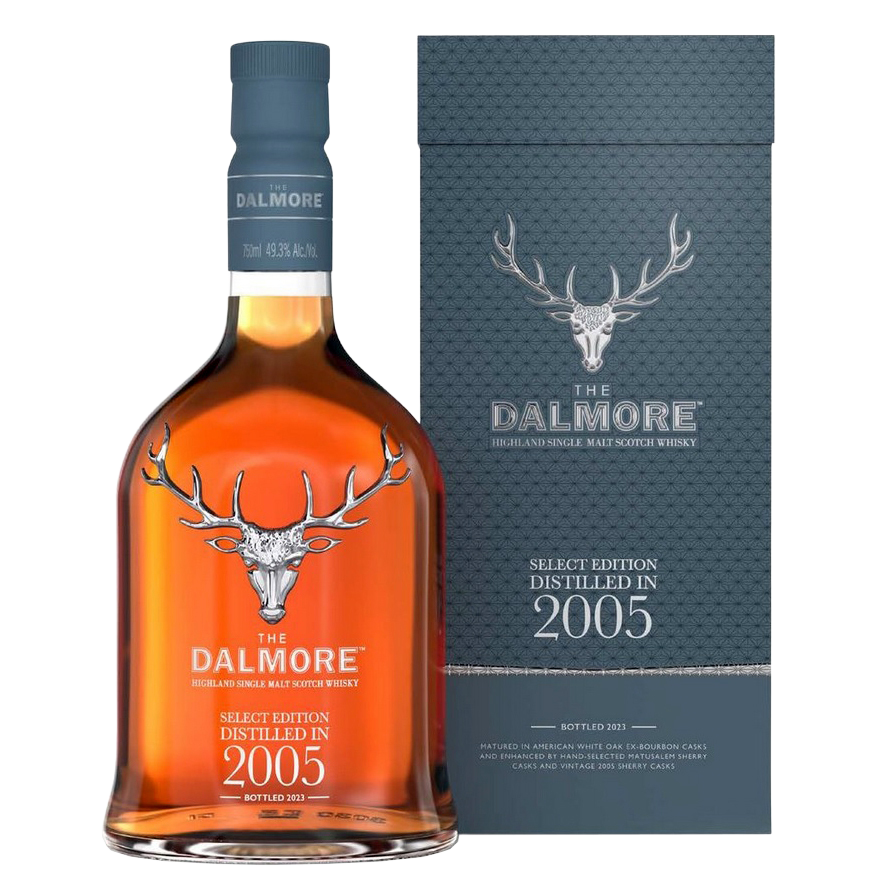 A bottle of The Dalmore 18 Year Old 2005 Vintage Single Malt Whisky stands beside its gray box with a silver stag logo and embossed text, displaying amber liquid inside.