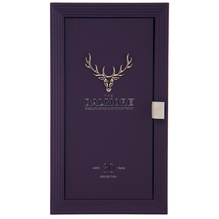A rectangular purple box features a silver stag head logo and “The Dalmore” at center. Below, it states “30 Year Old Highland Single Malt, 2023 Edition.” The textured box with side tab holds this luxury whisky.