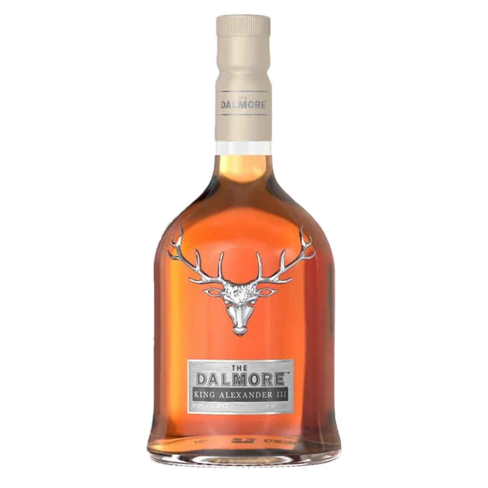 A bottle of The Dalmore King Alexander III Highland Single Malt Scotch Whisky, with a bronze liquid, beige cap, silver stag emblem, and the name below, showcases its famous six cask maturation on a plain white background.