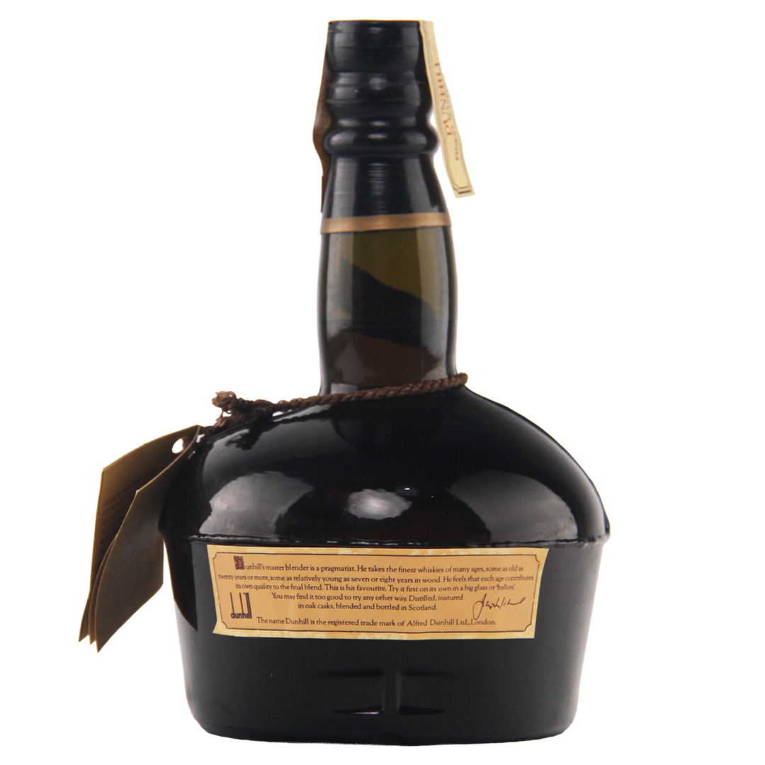 Whiskey bottle with a label on a white background