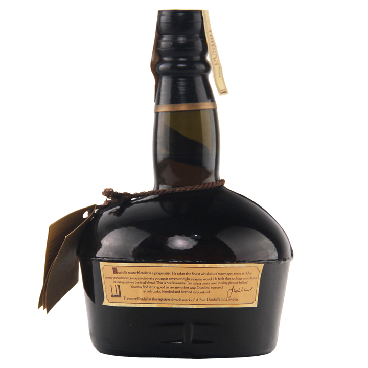Whiskey bottle with a label on a white background