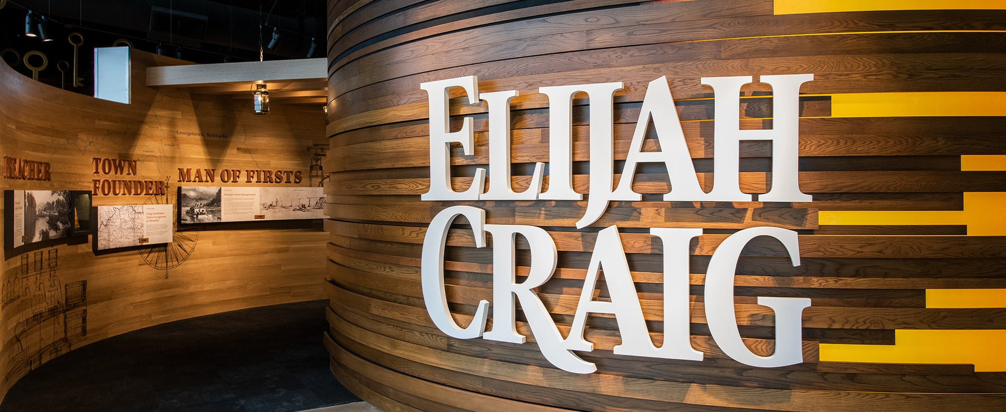 Wooden wall with 'Elijah Craig' branding in a museum setting
