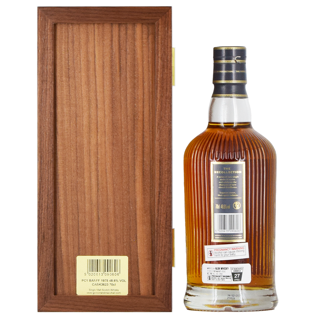 A bottle of Gordon & MacPhail Banff 1975 46 Year Old Single Malt Scotch Whisky 700ml with a gold and black label stands by an open wooden box, its collectible amber liquid showcased with a gold seal and neck strip.