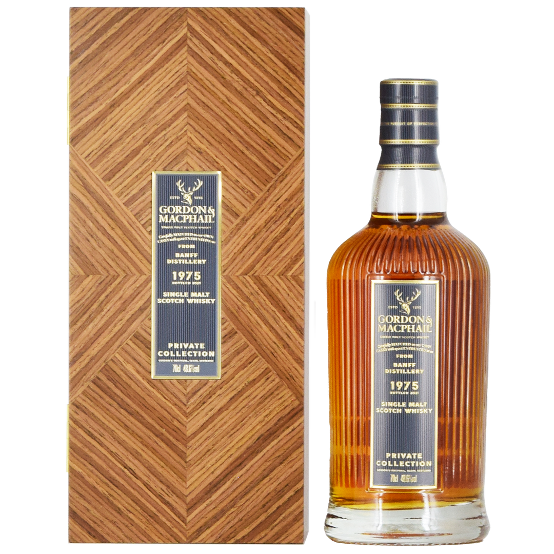 A bottle of Gordon & MacPhail Banff 1975 46 Year Old Single Malt Scotch Whisky 700ml stands beside a matching box, both adorned with elegant gold and black labels.