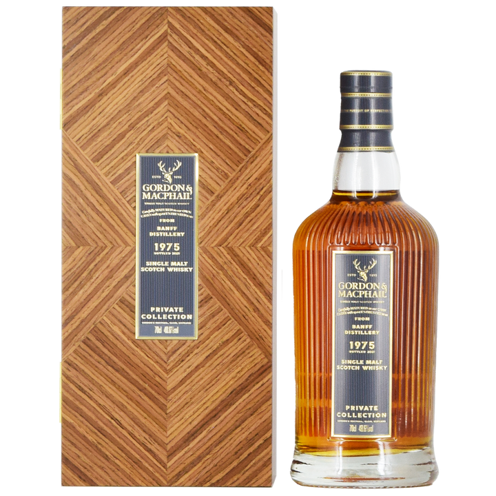 A bottle of Gordon & MacPhail Banff 1975 46 Year Old Single Malt Scotch Whisky 700ml stands beside a matching box, both adorned with elegant gold and black labels.