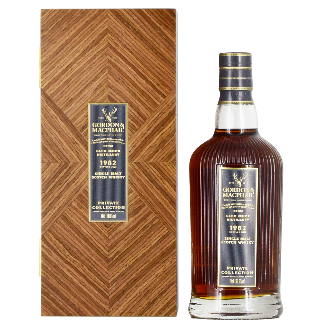 A bottle of Gordon & MacPhail Glen Mhor 1982 40 Year Old Single Malt Scotch Whisky 700ml stands beside its wood-patterned box, both adorned with gold and navy labels—a rare collector's item.
