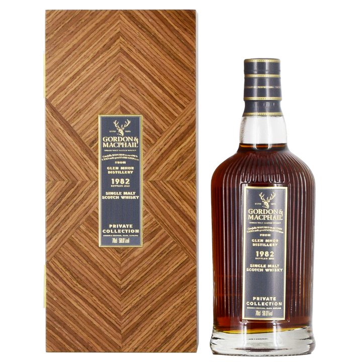 A bottle of Gordon & MacPhail Glen Mhor 1982 40 Year Old Single Malt Scotch Whisky 700ml stands beside its wood-patterned box, both adorned with gold and navy labels—a rare collector's item.