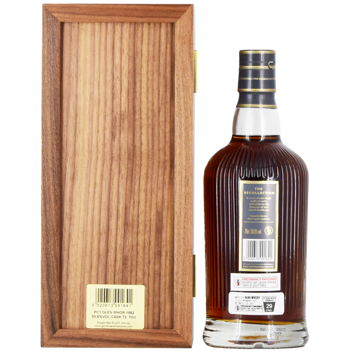 A bottle of Gordon & MacPhail Glen Mhor 1982 40 Year Old Single Malt Scotch Whisky 700ml, with a striped black and gold cap, stands by an upright wooden box; the back label is detailed and accented in gold.