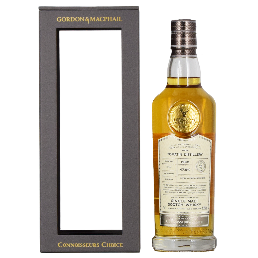 A bottle of Gordon & MacPhail Tomatin 1990 28 Year Old Single Malt Scotch Whisky 700ml stands beside its black and gold rectangular box with an open front.