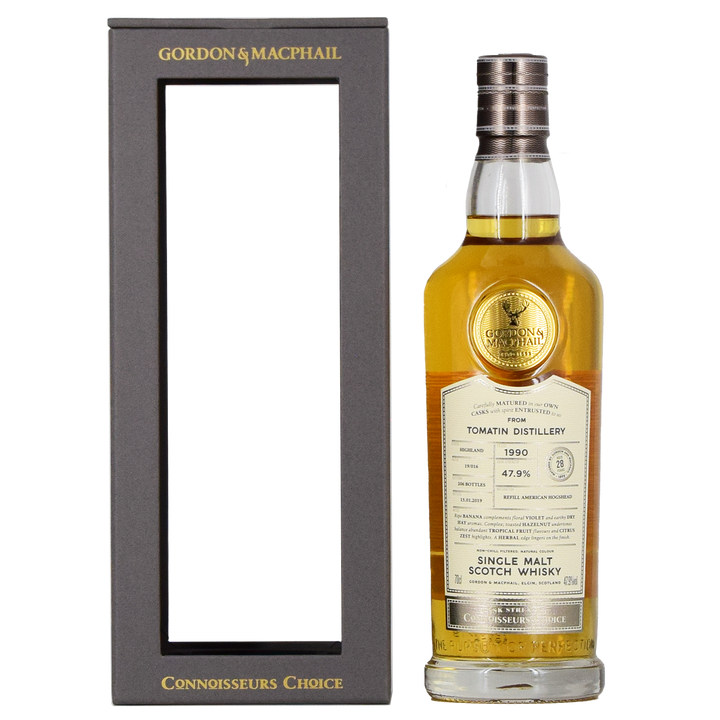 A bottle of Gordon & MacPhail Tomatin 1990 28 Year Old Single Malt Scotch Whisky 700ml stands beside its black and gold rectangular box with an open front.