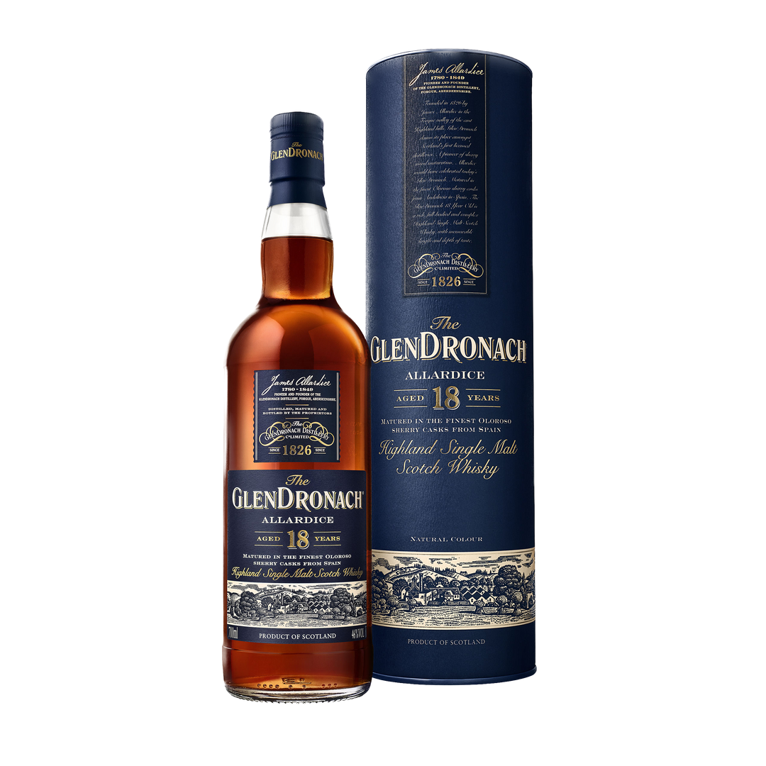 A bottle of Glendronach 18 Year Old Allardice Single Malt Scotch Whisky stands beside its cylindrical box, both featuring dark blue and gold labels that highlight sherry cask maturation and detailed decorative accents.