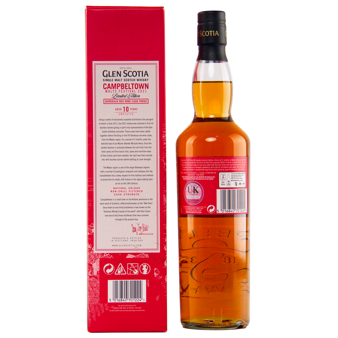 A bottle of Glen Scotia 10 Year Old Bordeaux Red Wine single malt whisky stands beside its red box, the back label noting its special maturation in Bordeaux red wine casks for the Campbeltown Malts Festival.
