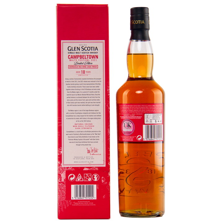 A bottle of Glen Scotia 10 Year Old Bordeaux Red Wine single malt whisky stands beside its red box, the back label noting its special maturation in Bordeaux red wine casks for the Campbeltown Malts Festival.