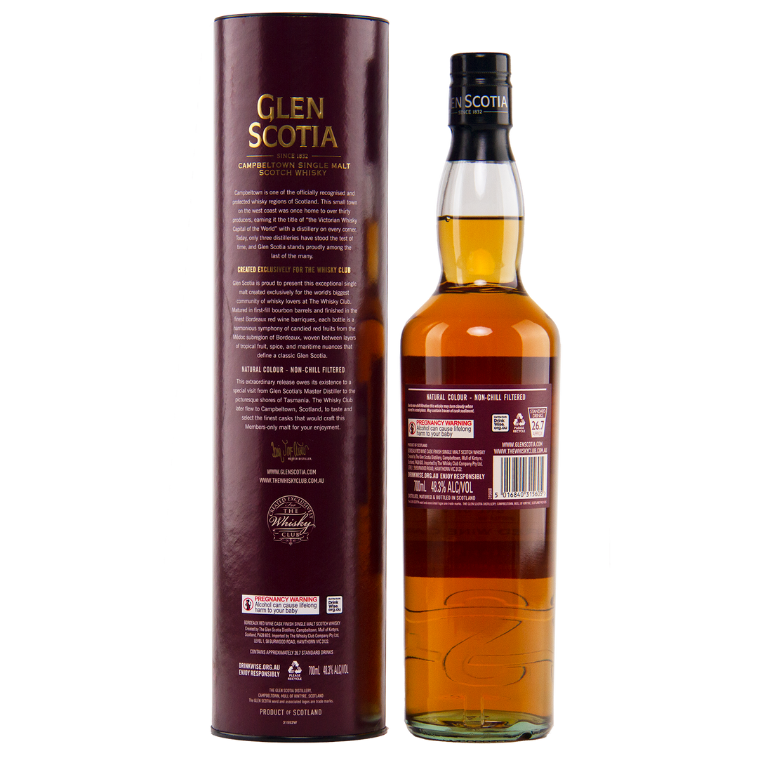 A bottle of Glen Scotia 2013 Bordeaux Single Cask single malt Scotch whisky stands beside its tall maroon box, both featuring gold and white labeling. The amber whisky was finished in a Bordeaux red wine cask with detailed product info displayed.