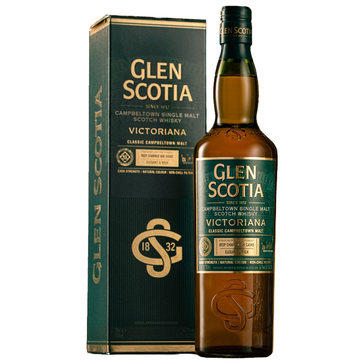 A bottle of Glen Scotia Victoriana Single Malt Scotch Whisky is displayed beside its matching green and gold box, both featuring the brand name and details in bold white and gold.