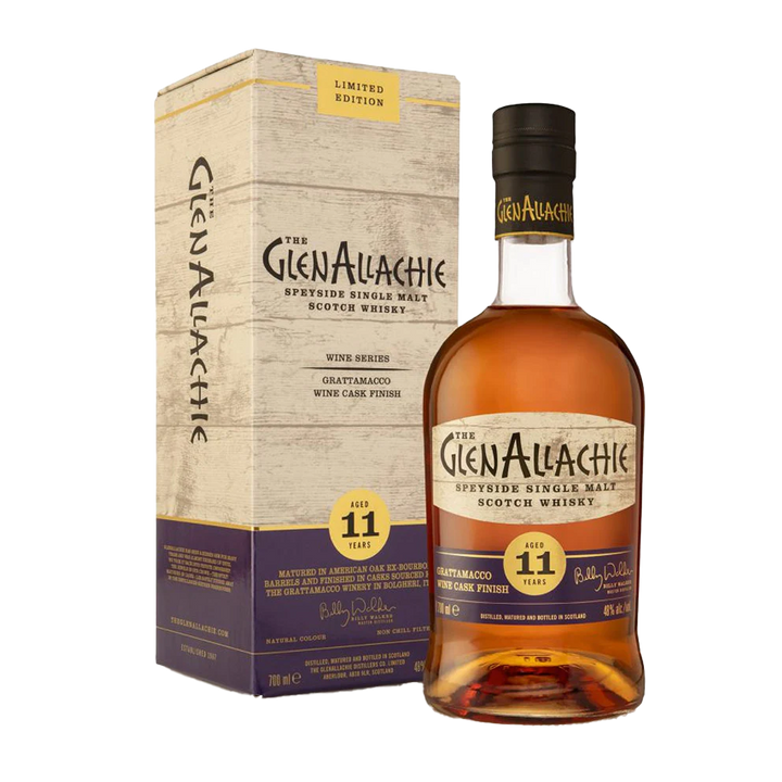 A bottle of GlenAllachie 11 Year Old Grattamacco Cask Finish Single Malt Scotch Whisky stands next to its matching "Limited Edition" box, both adorned with cream, purple, and gold accents.