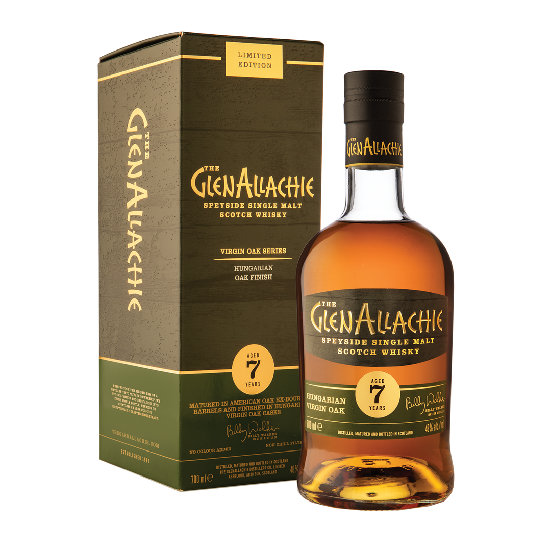 A bottle of GlenAllachie 7 Year Old Hungarian Oak Single Malt Scotch Whisky stands beside its matching green and gold box, showcasing the label and emphasizing its limited edition release.