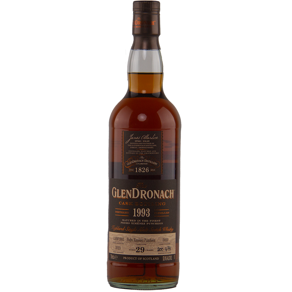A bottle of Glendronach 1993 29 Year Old, single cask release, with a dark brown label showing "Case Serving, 1993 cask bottling, 29 years old" and distillery details; features a rich amber hue.